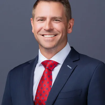 Adam Merrick Real Estate logo