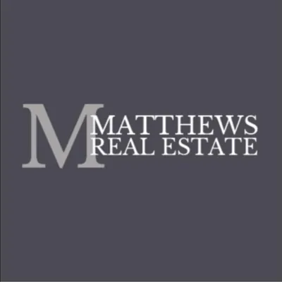 Matthews Real Estate logo