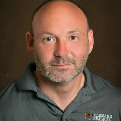 Ritchie Riggs Goldmark Realtors logo