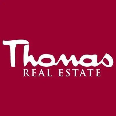 Thomas Real Estate logo