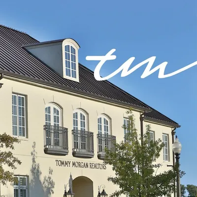 TM Realtors logo